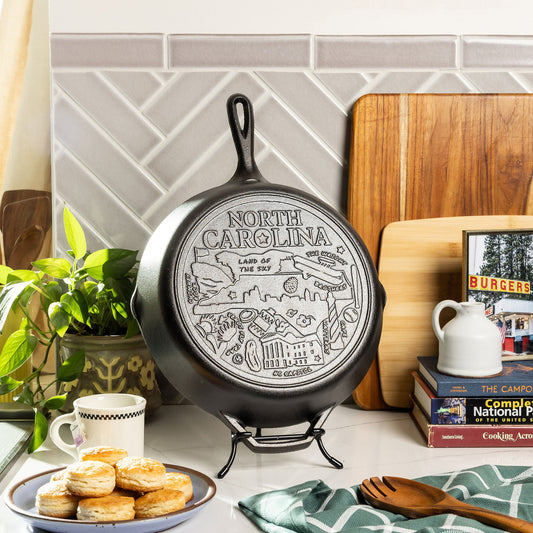North Carolina state skillet, displayed on counter with skillet stand and home decor.