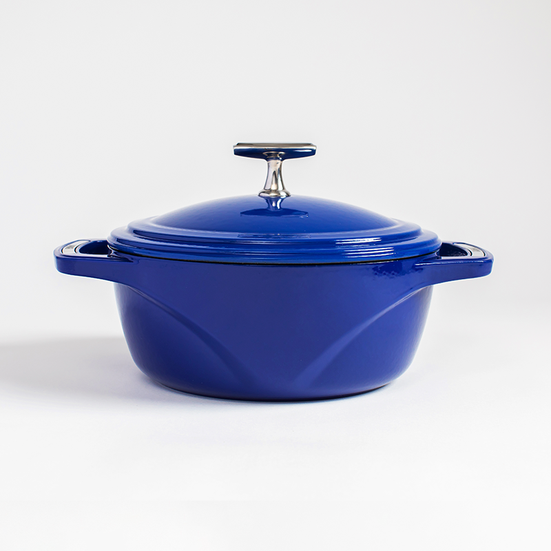 Blue enameled cast iron Dutch oven with a lid on a white background