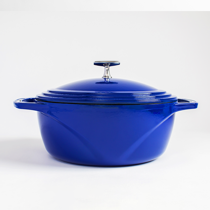 Blue enameled cast iron Dutch oven with a lid on a white background