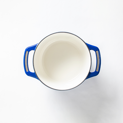 Inside of dutch oven, with a white enameled interior.