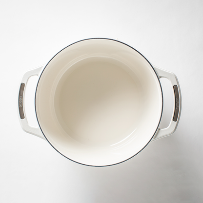 Inside of dutch oven, with a white enameled interior.