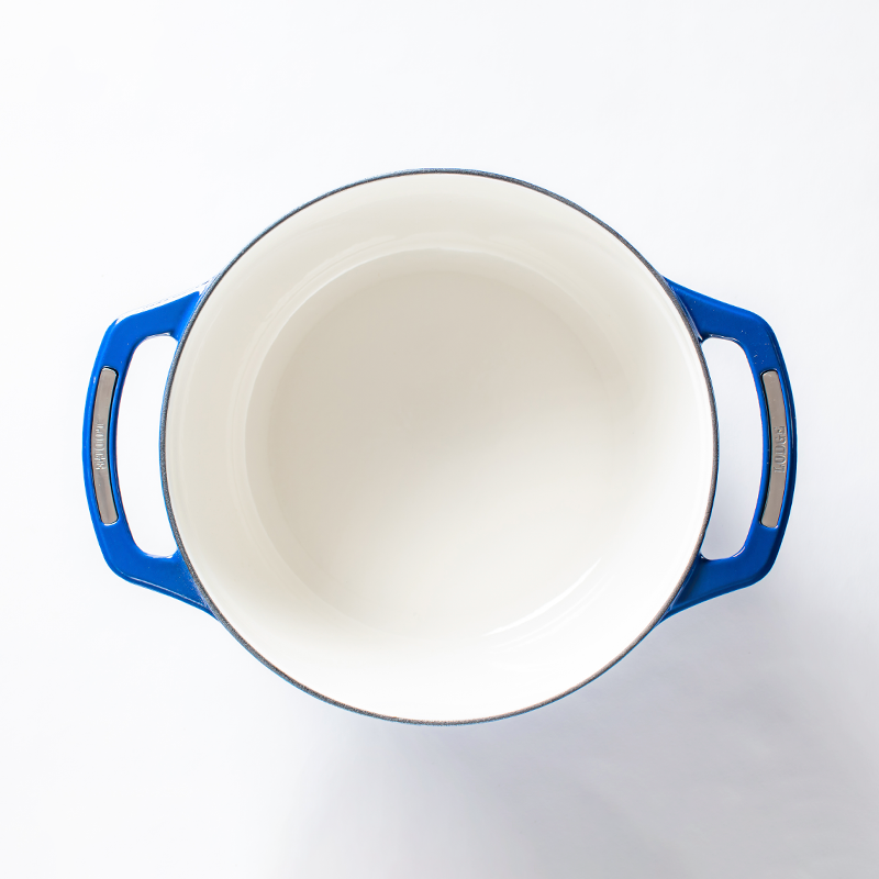 Inside of dutch oven, with a white enameled interior.