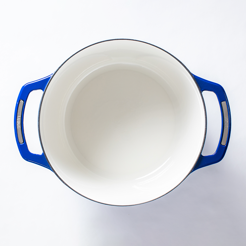 Inside of dutch oven, with a white enameled interior.