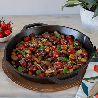 Freshly made dish with sausage, tomato's, potato's, and basil.