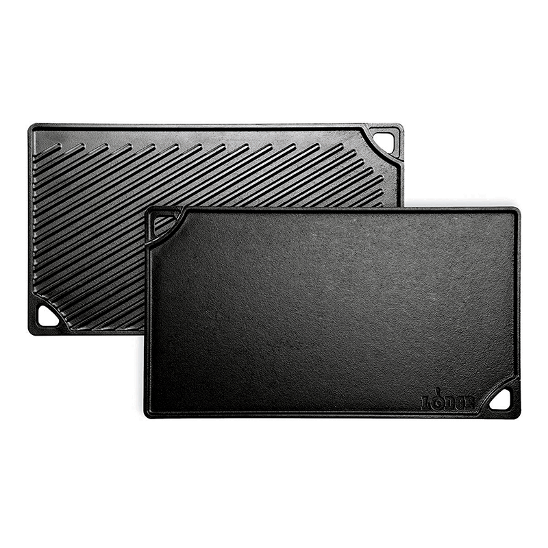 Two black reversible grill/griddle pans, one with a ribbed surface and the other with a smooth surface, both with handles.