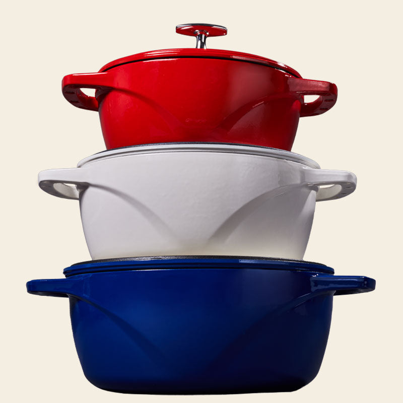 Blue, white, and red duch ovens stacked in order from bottom to top.