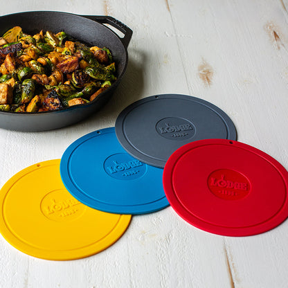 All color options laid out on counter next to a skillet with fresh brussel sprouts.