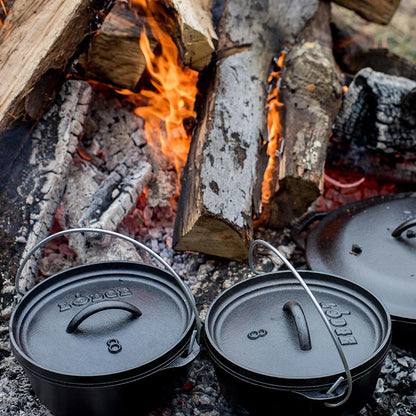 Dutch oven's near fire.
