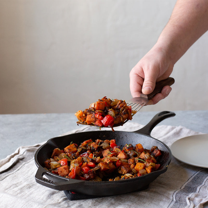 Freshly prepared skillet hash, being served from skillet.
