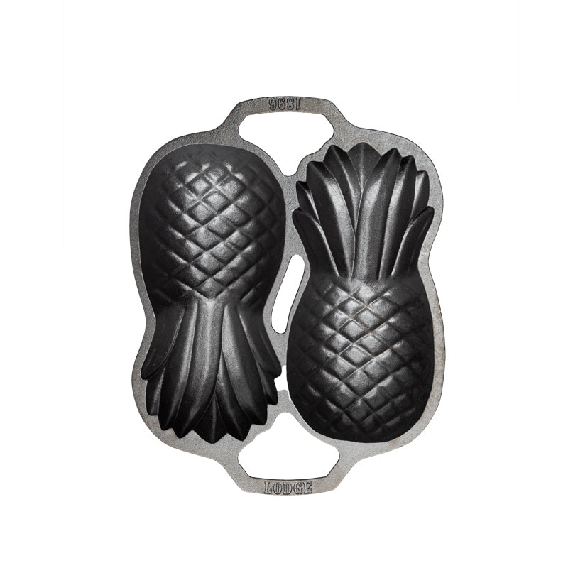 Top view of cast iron pan with 2 Pineapple-shaped molds.