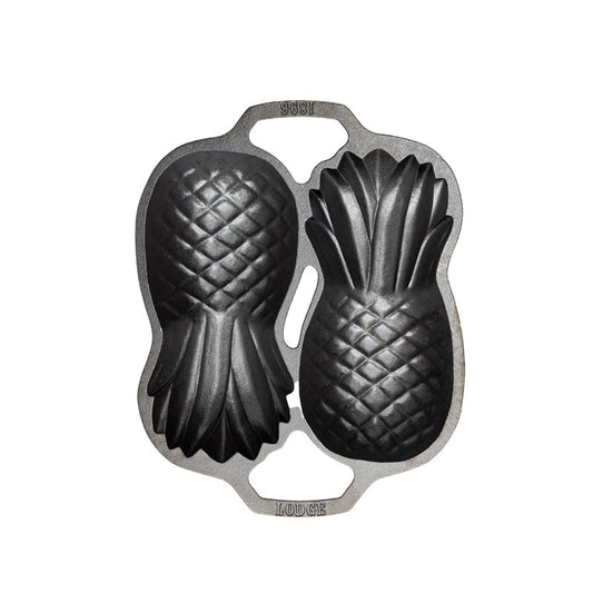 Top view of cast iron pan with 2 Pineapple-shaped molds.