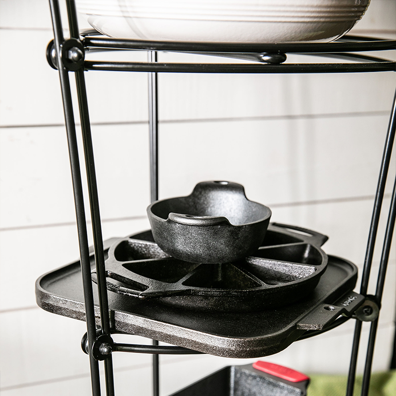Close up of one shelf that's carrying our single burner griddle, wedge pan, and mini server.