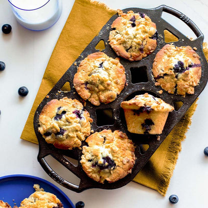 Freshly made blueberry muffins, prepared and served in pan.