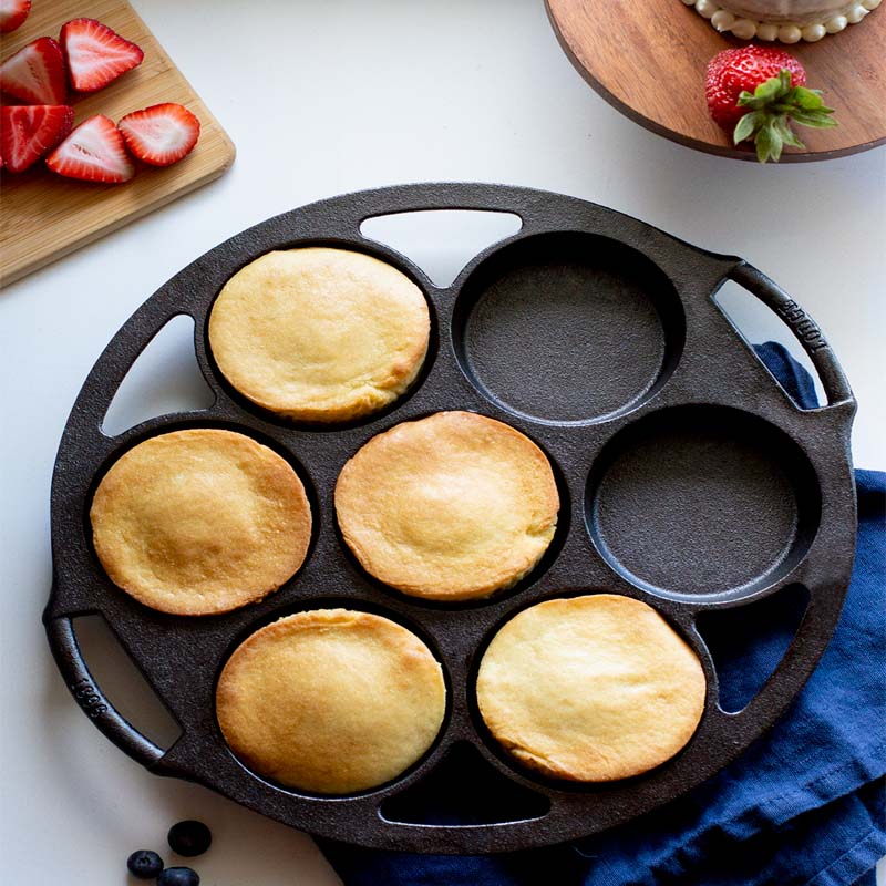 Freshly baked mini cakes in pan.