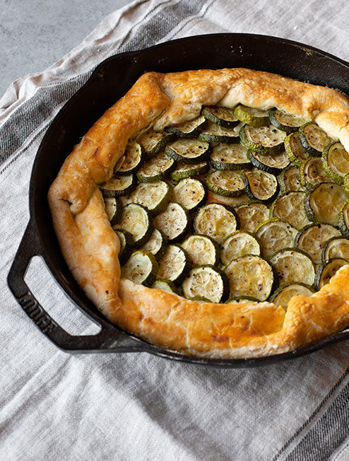 Our roasted zucchini and scallion galette, prepared and served in skillet.