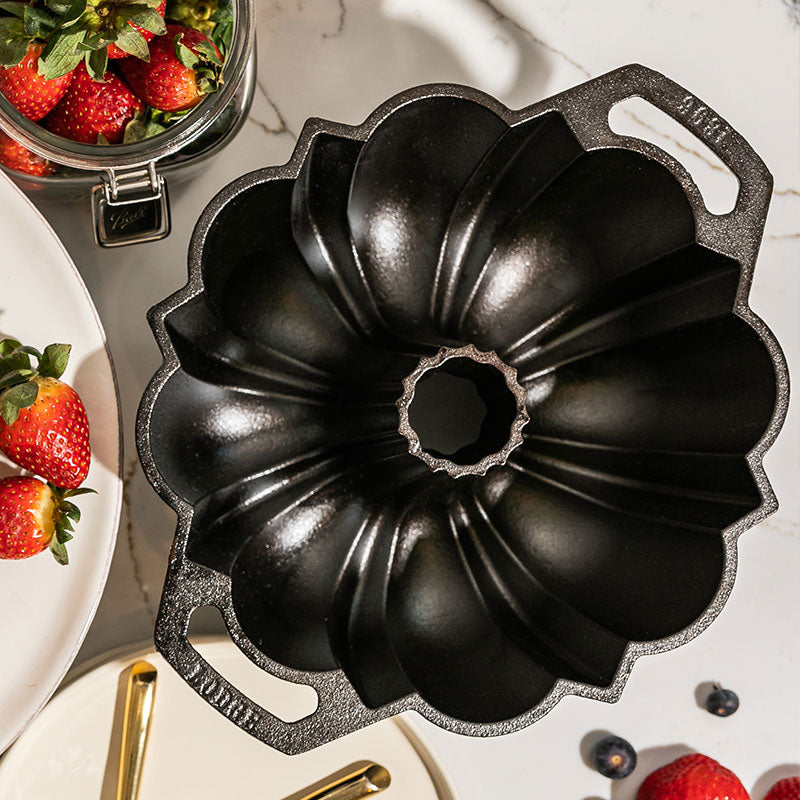 Pan on kitchen counter near strawberries.