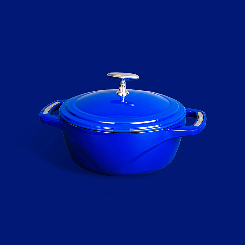 Blue dutch oven on blue background.