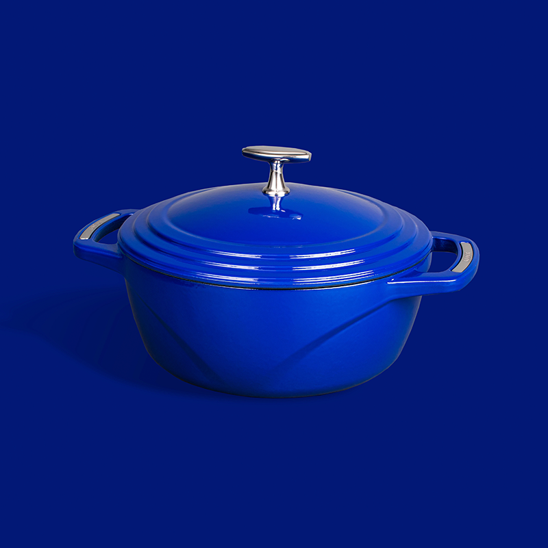 Blue dutch oven on blue background.