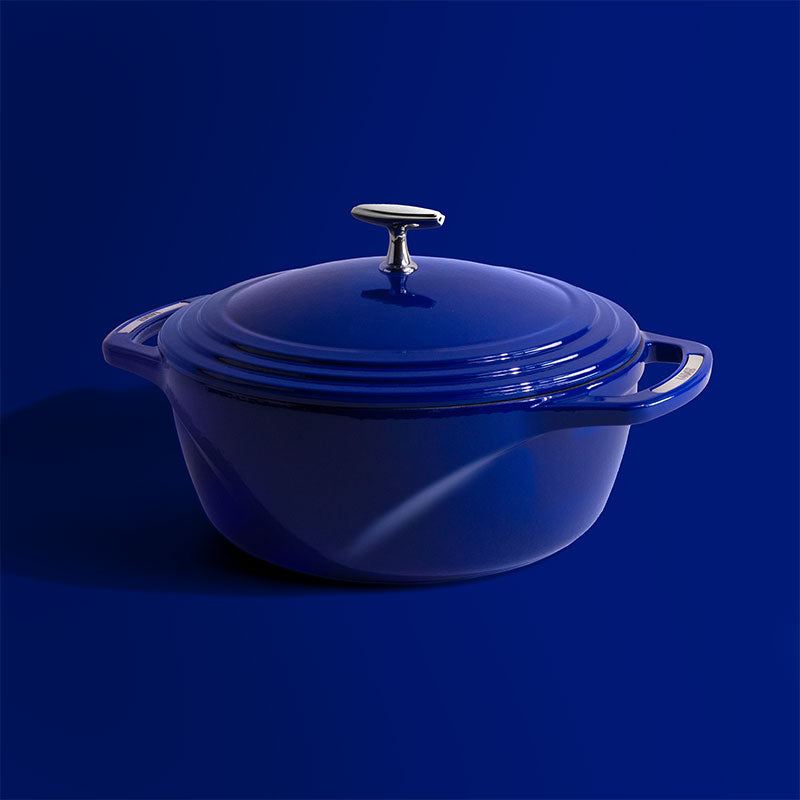 Blue dutch oven on blue background.