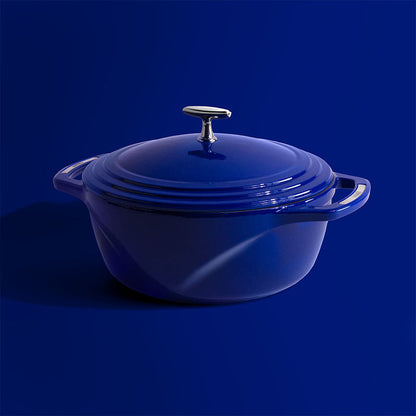 Blue dutch oven on blue background.