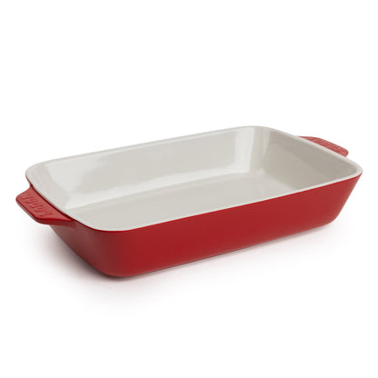 Cherry-red 13-by-9-inch stoneware casserole dish with white interior.