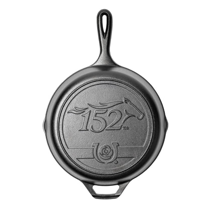 Black cast iron skillet with '152' logo on a white background