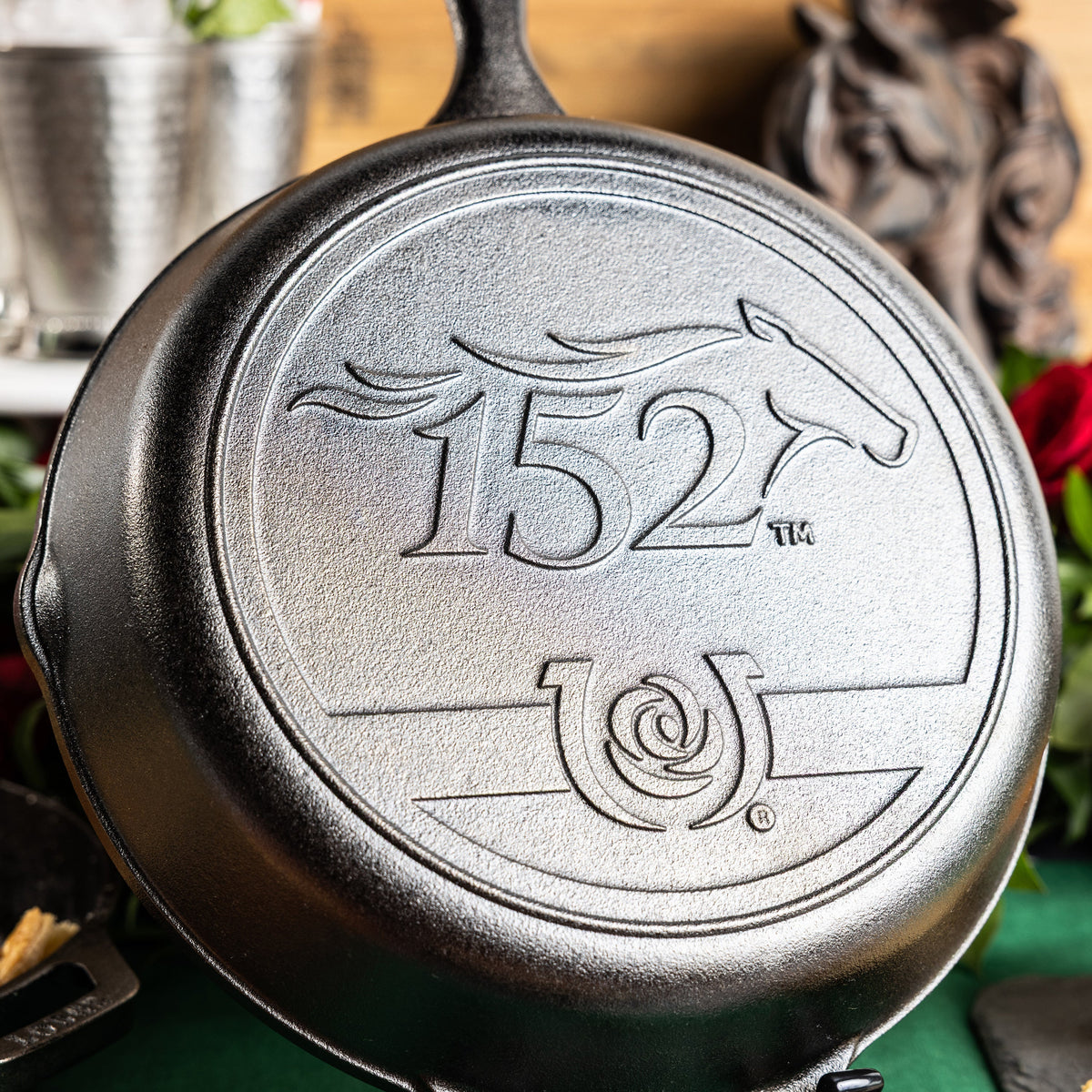 Close up of the 152nd Kentucky Derby logo on a cast iron skillet.