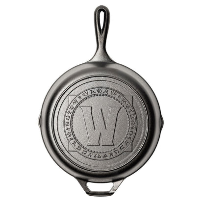 Cast iron skillet with a World of Warcraft engraved logo.