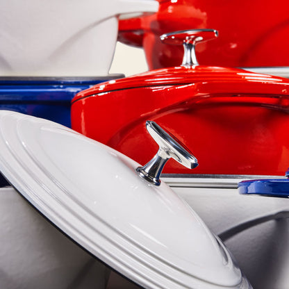Stacks of red, white, and blue dutch ovens.