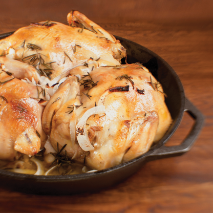 Chicken served in cast iron skillet.