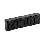 Black rectangular block with 'LODGE' embossed on a white background