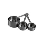 A set of stainless steel measuring cups in different sizes, with a long handle and spout for pouring.