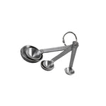 Set of stainless steel measuring spoons on a white background