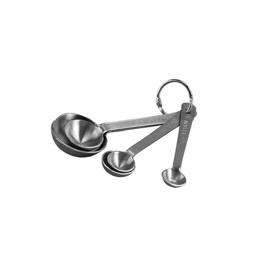 Set of stainless steel measuring spoons on a white background