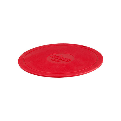 Red circular trivet with Lodge branding in center.