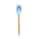 Spatula with blue silicone head and wooden handle on a white background
