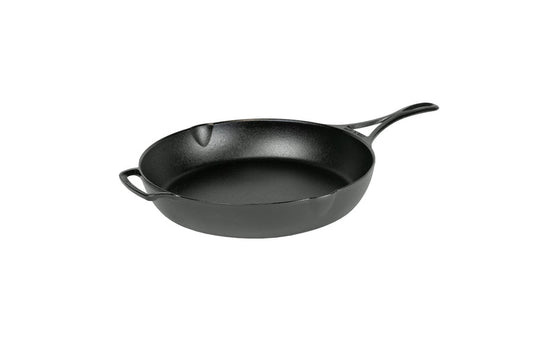 A black, cast iron skillet with a long handle and a loop handle on other side, along with two pour spouts on opposite sides.