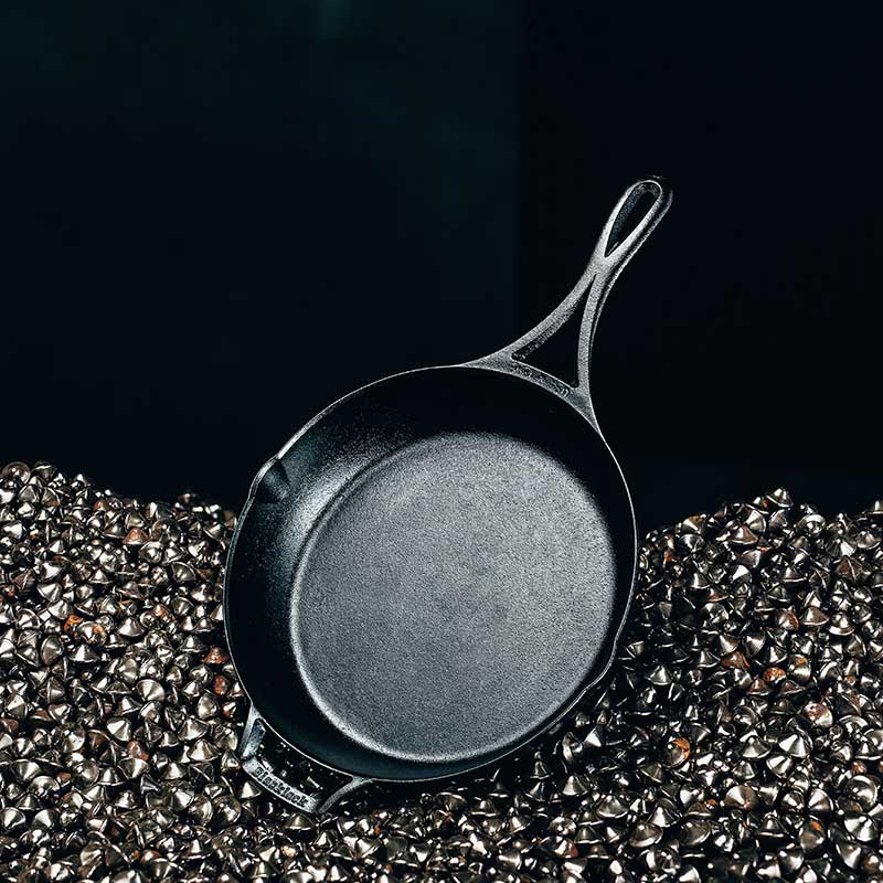 10.25 inch skillet on black background.