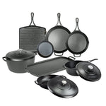 Set of black cast iron cookware including skillets, pans, and a dutch oven on a white background