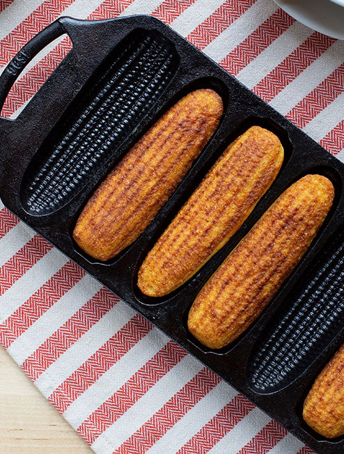 Baking pan on table with cornbread.