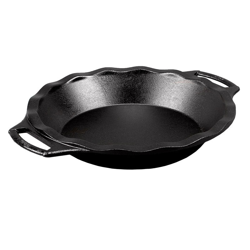 A black cast iron pie pan with two handles on the sides.
