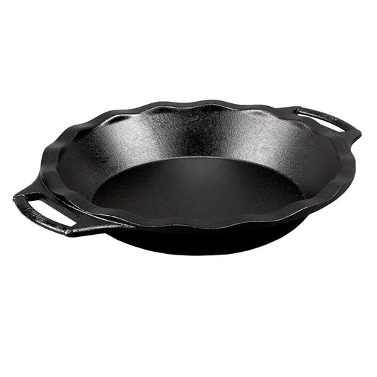 A black cast iron pie pan with two handles on the sides.