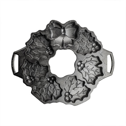 Top view of pan featuring details of the 6 mistletoe cake sections and bow.