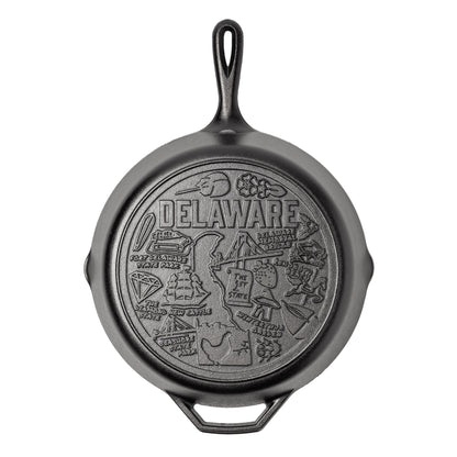 Cast iron skillet with the bottom engraved with beloved icons and monuments from Delaware.