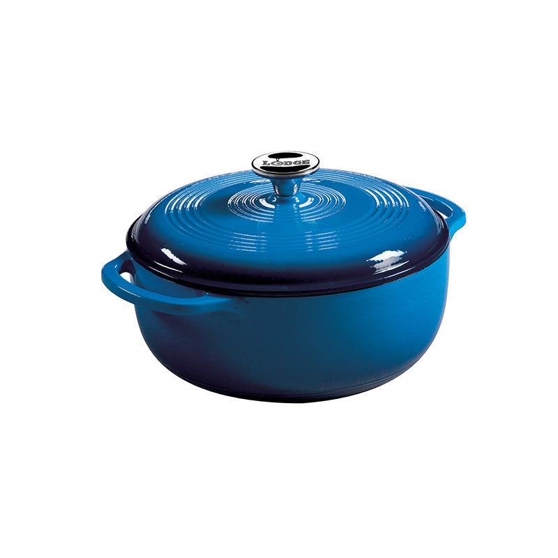 Blue gradient enameled cast iron Dutch oven with lid, both pieces have light blue on top and darken towards the bottom.