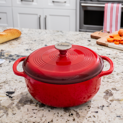 Dutch oven on kitchen counter near prepped ingredients.