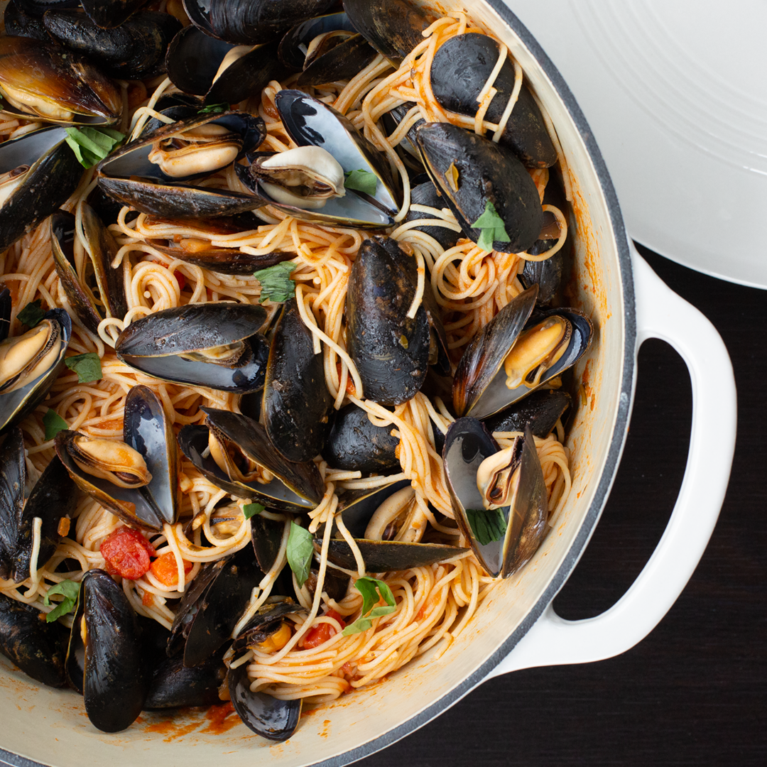 Fresh mussels pasta made in dutch oven.