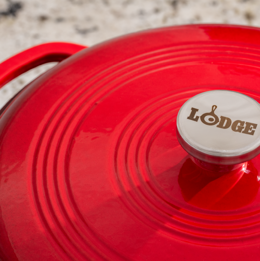 Close up of lid featuring silver knob with Lodge branding.