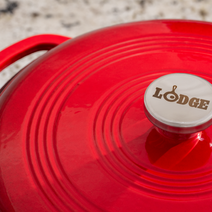 Close up of lid featuring silver knob with Lodge branding.