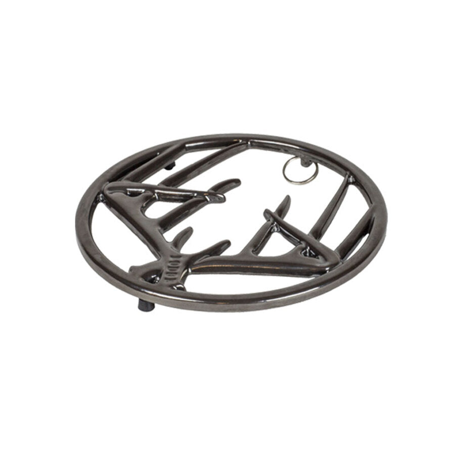 Black midnight chrome enamel trivet with decorative antler design on a white background